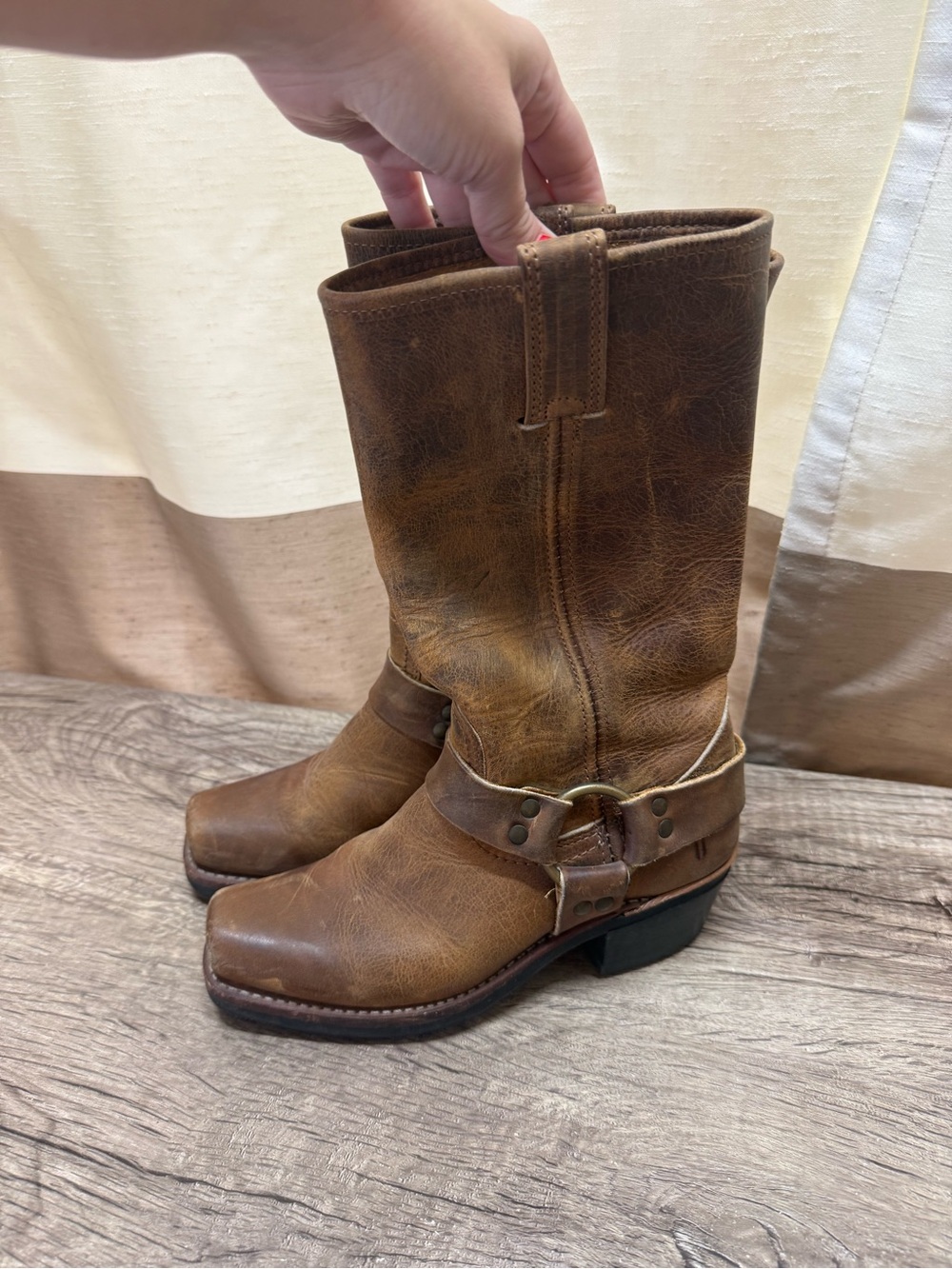 Frye Harness 12R leather boots featuring a distressed brown finish and classic O